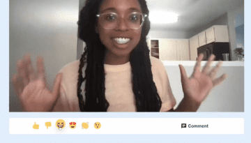 Image of a woman waving on a webcam video over a row of emojis: a thumbs up, thumbs down, laughing, heart eyes, clapping and surprised, next to a comment button